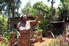 Jane Kabugi explains how heavy rain was destroying her home and farm. Credit: SM