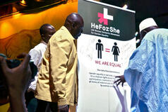 Male attendees sign the HeForShe Solidarity banner. Photo credit: UNWomen/Ruth W